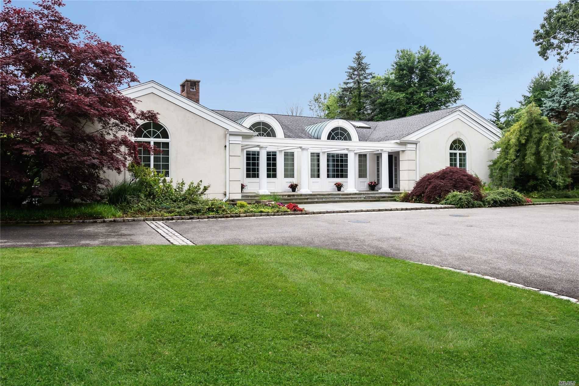 A true treasure ! Welcome to this pristine extremely private residence in the heart of Oyster Bay Cove.