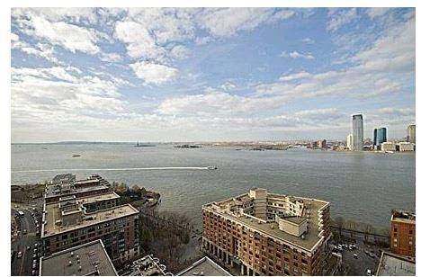 Spacious Sunny Big 1 Bedroom apartment with balcony and direct Statue of Liberty and Hudson water views in the heart of the Battery Park City.
