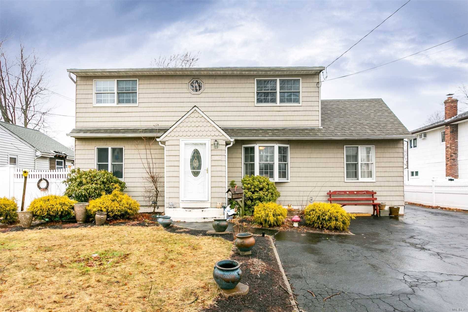 Lovely Expanded Cape In The Village Of Lindenhurst Featuring A Huge Master BR, 3 Other BRs, 2 Full Baths, Wood Floors, Gas Heat, Huge Driveway, IGS, 2nd Floor Previously Had ...