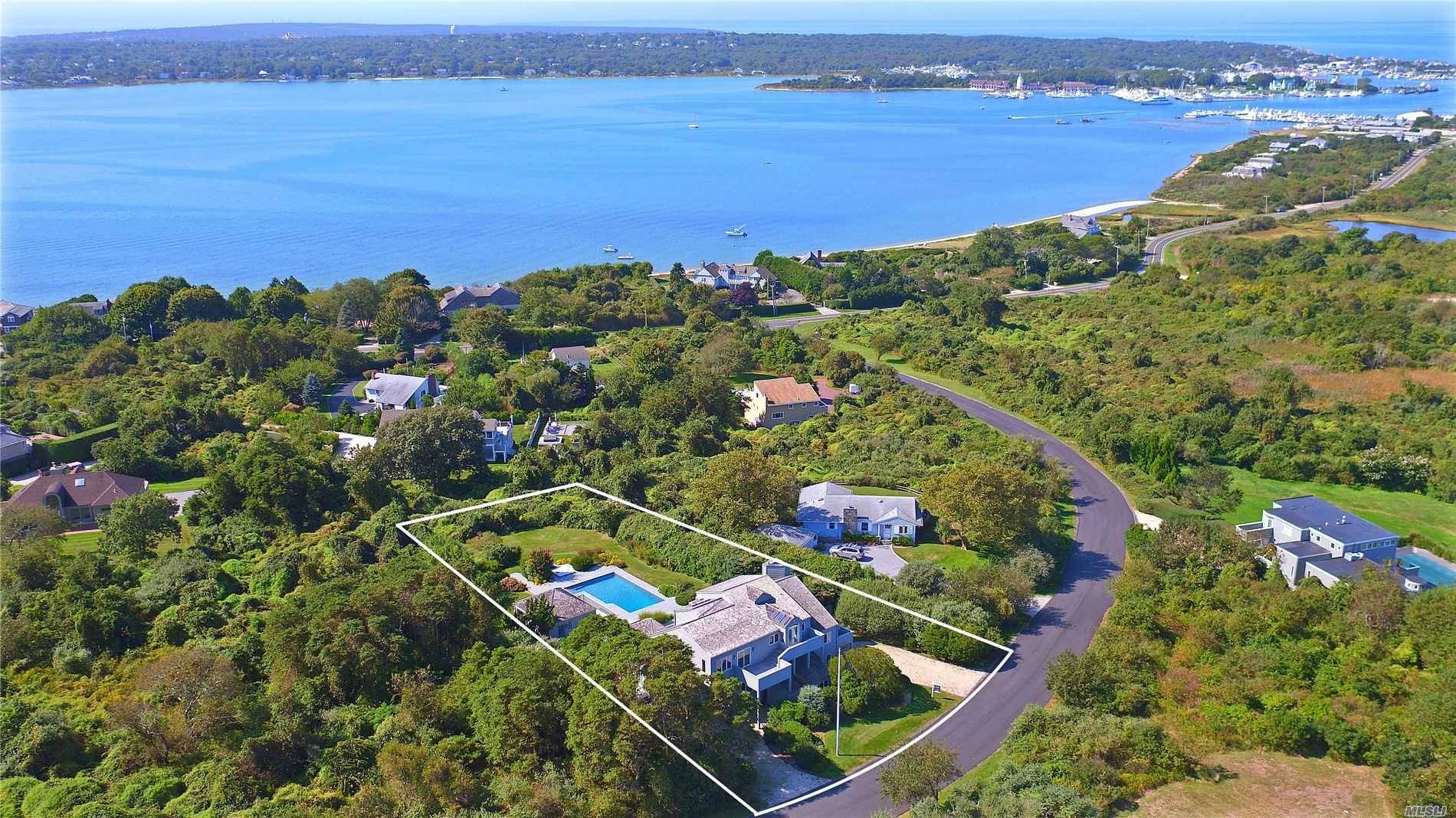 Sunrise and sunset sweeping views of Ocean, Lake Montauk and Bay from elevated East Lake Drive Contemporary home.