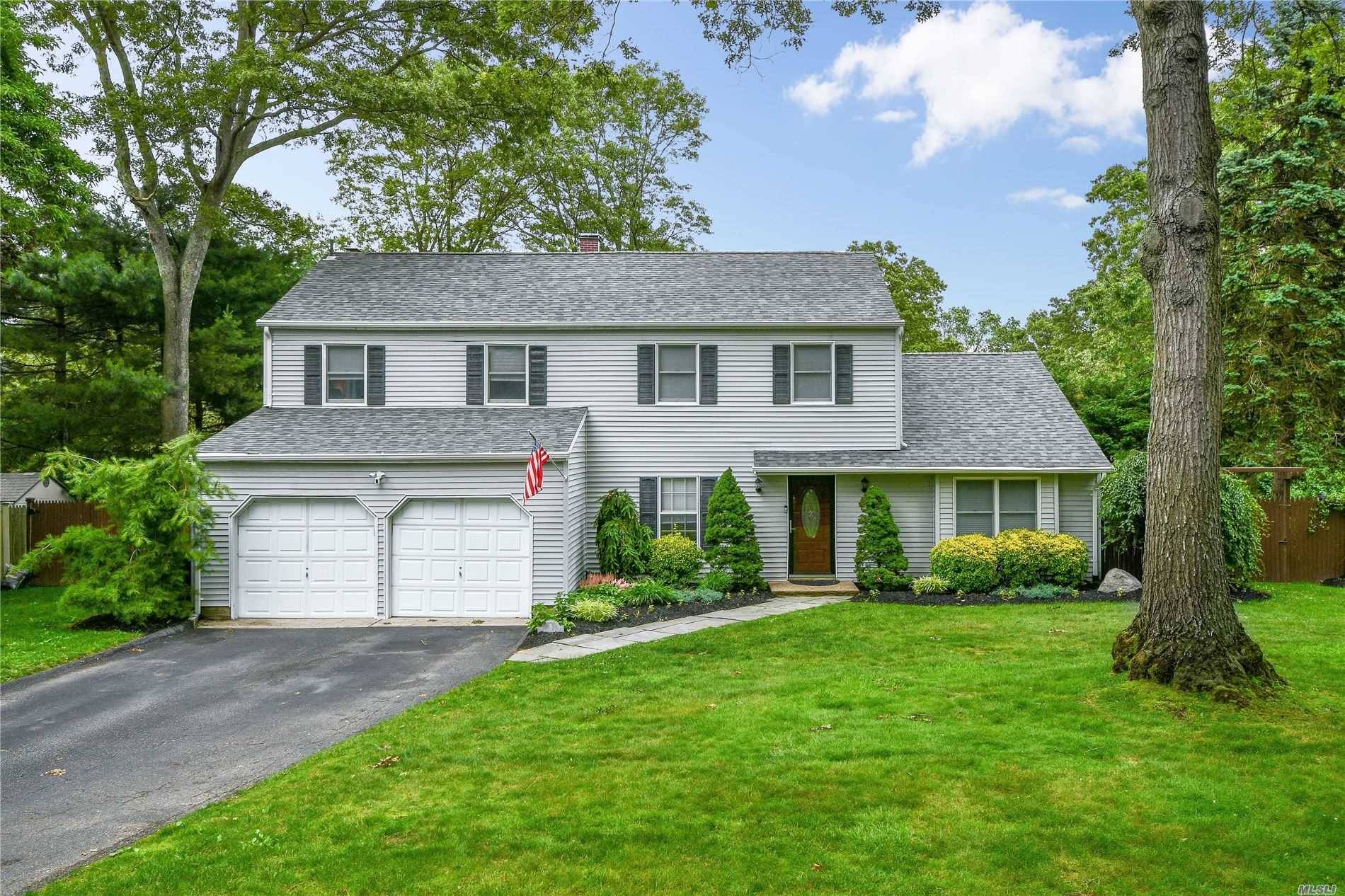Beautifully updated and maintained Colonial on a tree lined cul de sac.