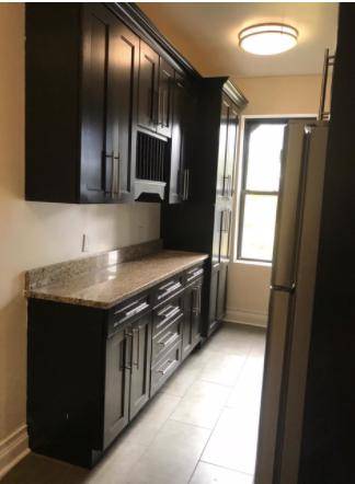 This apartment Beautiful Pre War Extra large Two Br is very bright amp ; fully renovated, Just a block from train and the Famous Historical landmark Sunnyside Gardens.
