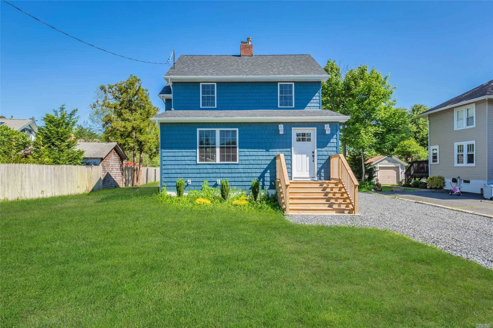 This Completely Remodeled South Sayville Colonial Offers A Gorgeous EIK w Quartz Counters, SS Appliances, Farm Sink Center Island, Living Room, Formal Dining Room, Fireplace, New Hardwood Floors Up Down, ...