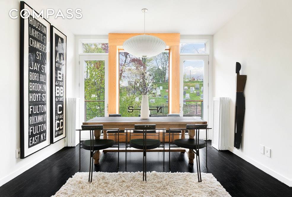 At the highest point in Brooklyn and on a quiet tree lined, one way street sits an incredible, design forward townhouse, the likes of which is rarely available.