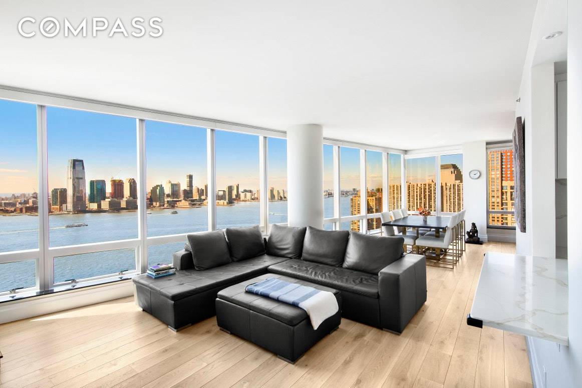Make the stunning New York Harbor your daily backdrop in this spectacular, renovated two bedroom, two and a half bathroom home in the renowned Ritz Carlton Battery Park condominium.