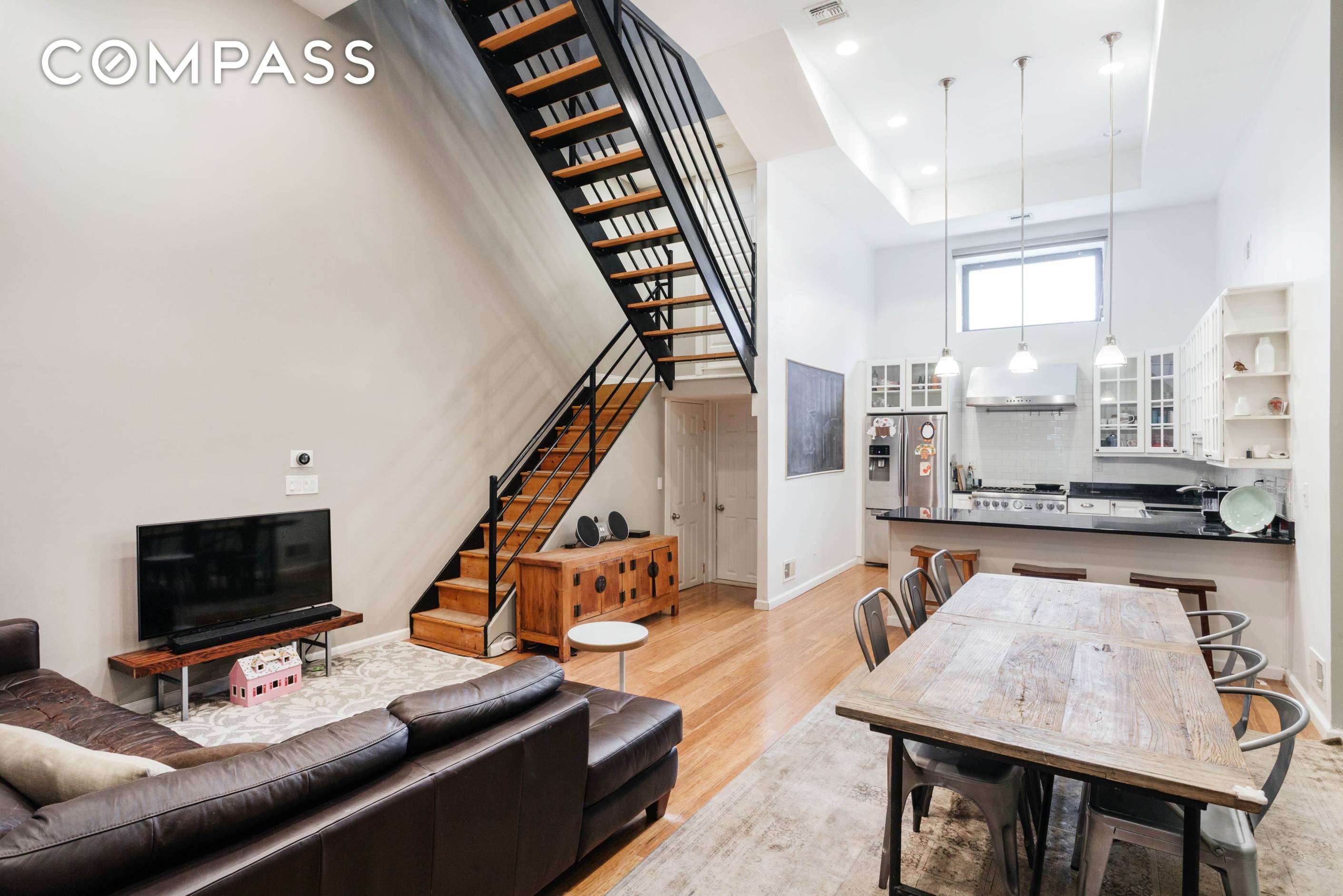 This three story brick single carriage house is sophisticated and serene.
