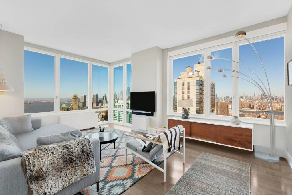 Spacious and bright, this sky high two bedroom two bath home offers northwest exposures for sweeping views from every room, including the Empire State Building, One World Trade Center, the ...
