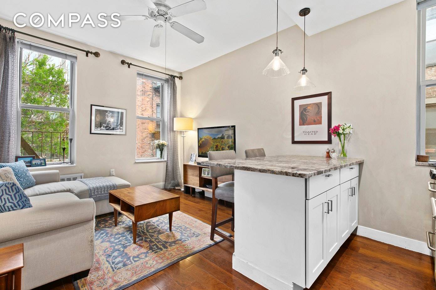 A charming and sun bathed two bedroom home with three exposures on a beautiful, tree lined block in the heart of Hell's Kitchen.