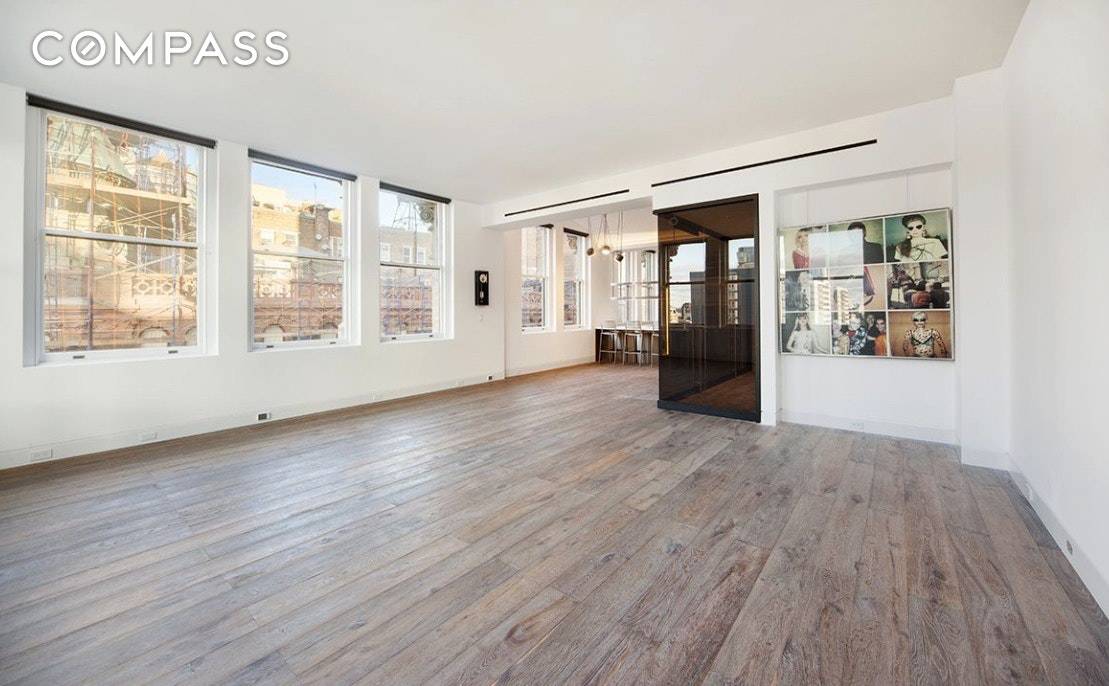This meticulously renovated three bedroom, three bathroom loft penthouse filled with sunlight, premium finishes and stunning design sets a new standard for refined living in a historic NoHo building.
