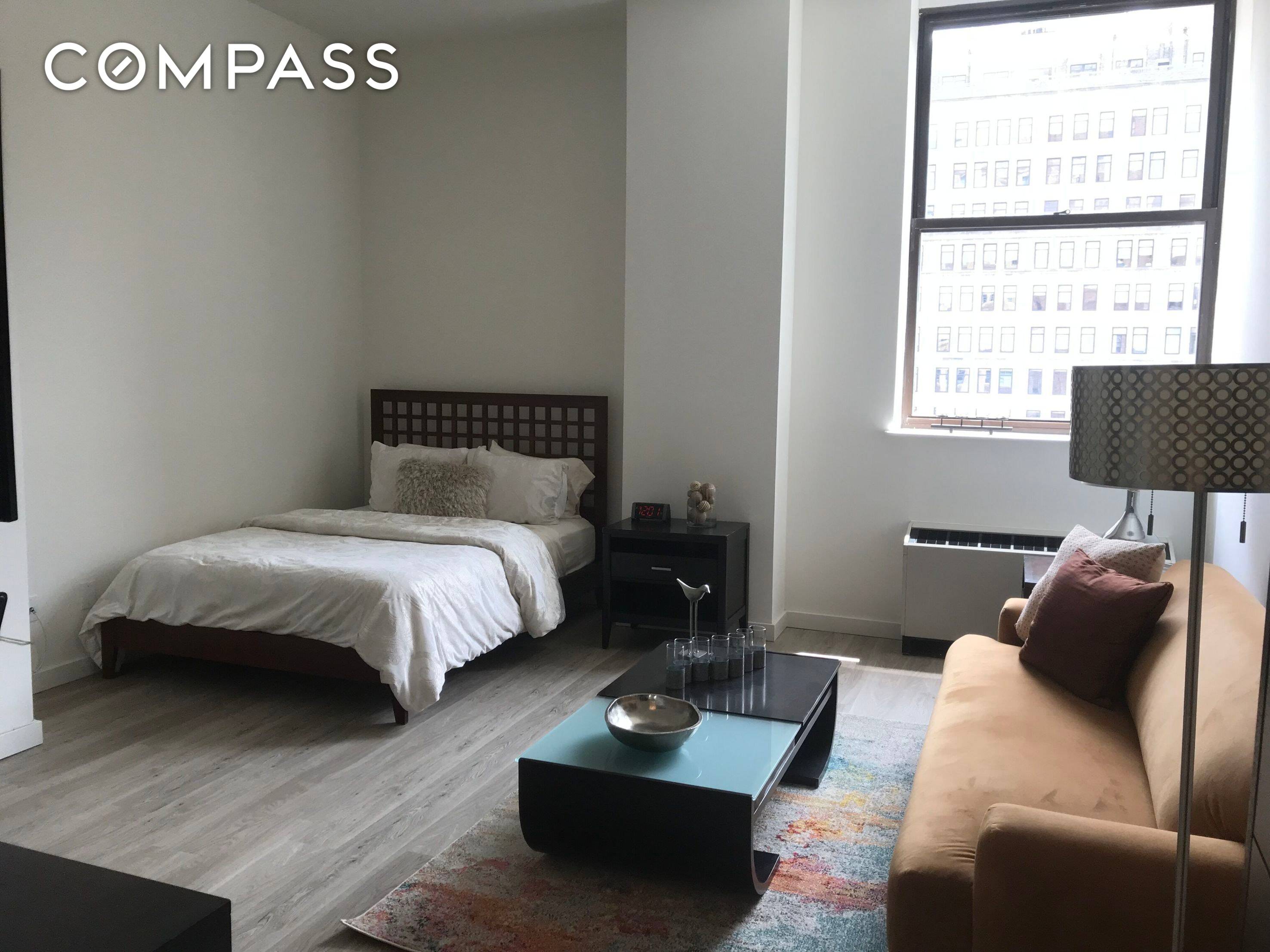 Unit 22M is a loft like Studio apartment located in the full service Downtown Club.