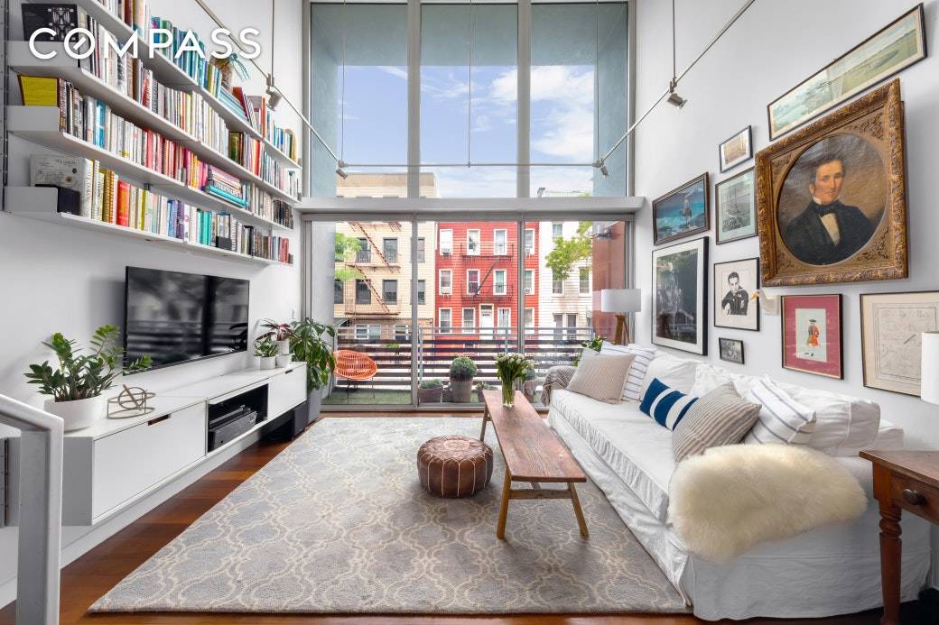 Stunning, light filled and with double height ceilings, this 2BR Mezzanine convertible 3 1BA condo with private balcony and private storage room is in the heart of picturesque Greenpoint but ...