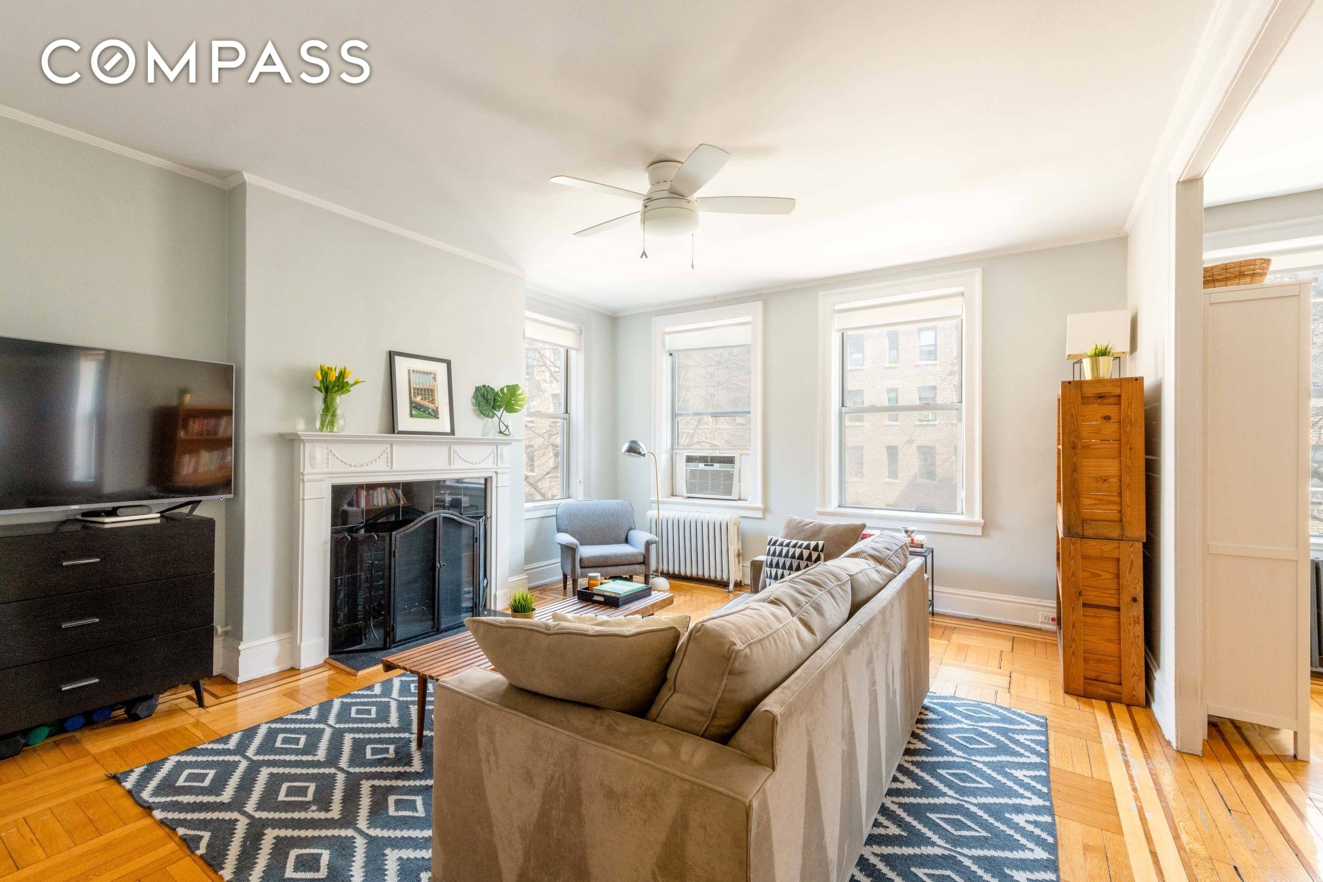 A welcoming light filled Jackson Heights co op offers a spacious two bedroom and one bath unit with a wood burning fireplace and formal dining room.