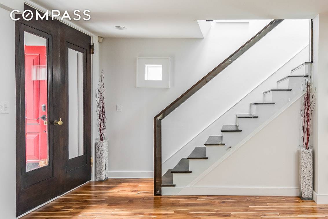 This is a one of a kind stunning Astoria townhouse.