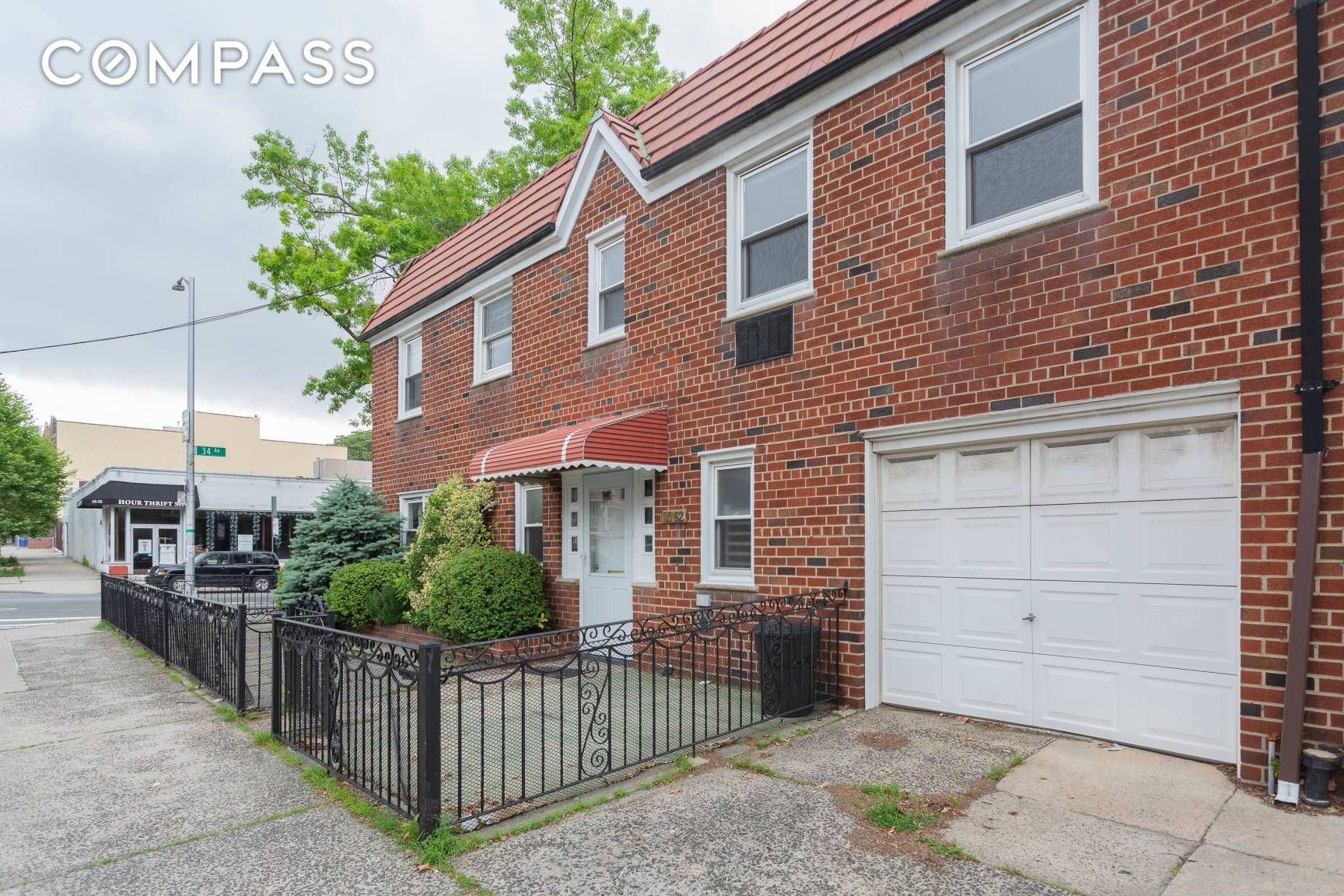 Coveted corner location, 2 family brick house with parking for multiple cars.