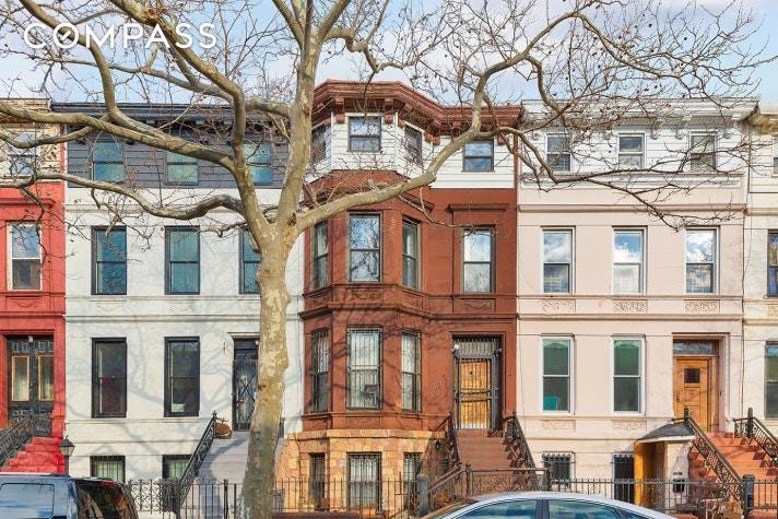 This stunning four story two family brownstone is full of intact original details including fireplaces, wainscoting, pocket doors, crown moldings, wooden shutters, fireplaces, hardwood floors, built in cabinetry, south facing ...
