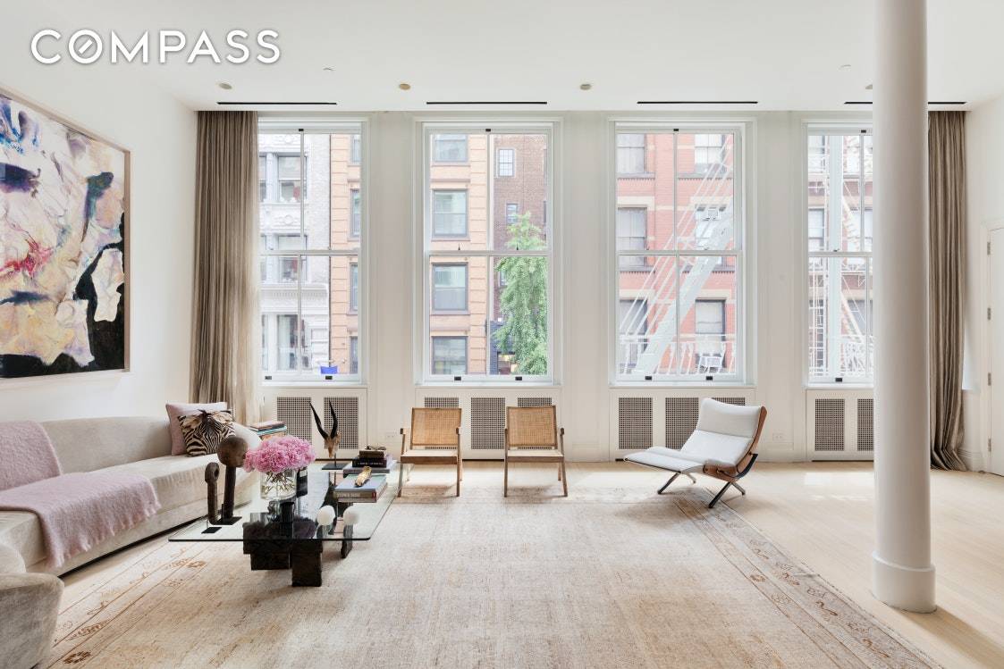 In the heart of Soho, this spectacular turn key home offers the best of loft living.