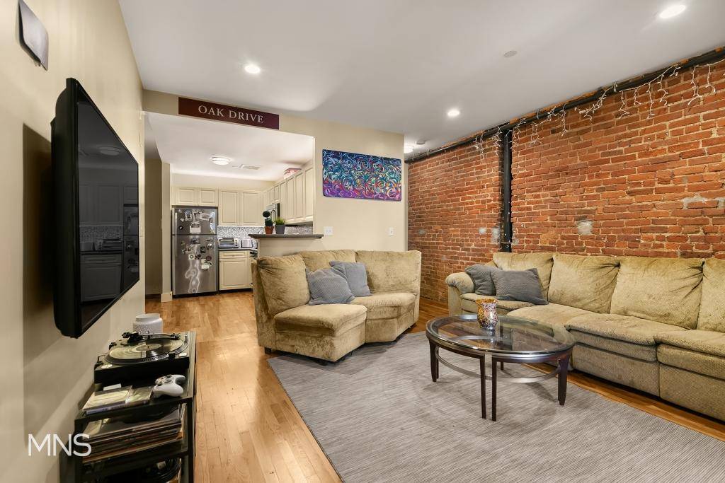 At almost 1, 000 square feet, Apartment 3B is a spacious three bedroom home featuring large bedrooms and living areas and finished with exposed brick and white oak hardwood floors.