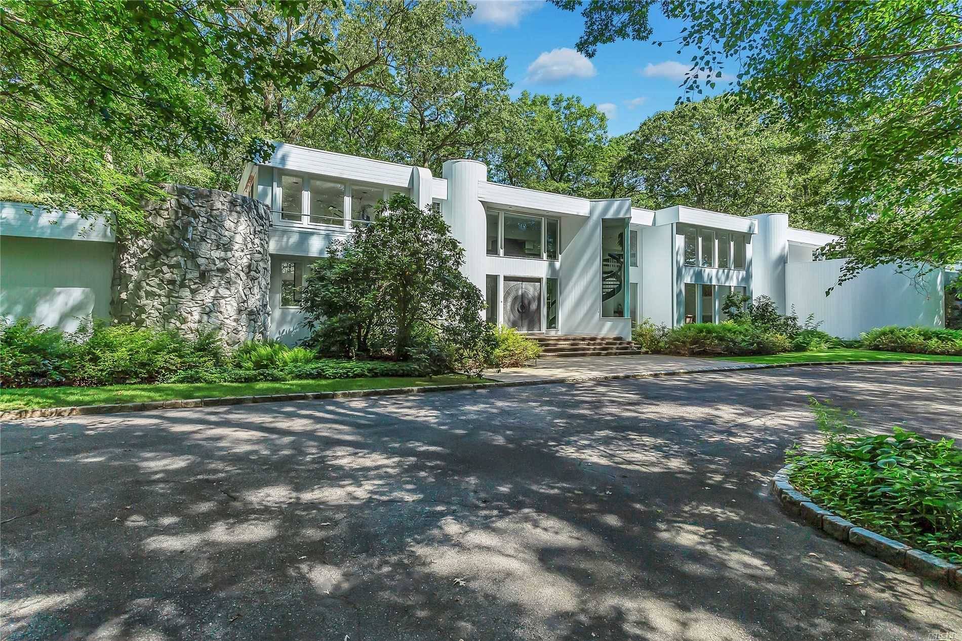 As original owners of this striking Modern home built in 1989, these sellers were ahead of their time w large white marble tiled flooring, floor to ceiling granite fpl, custom ...