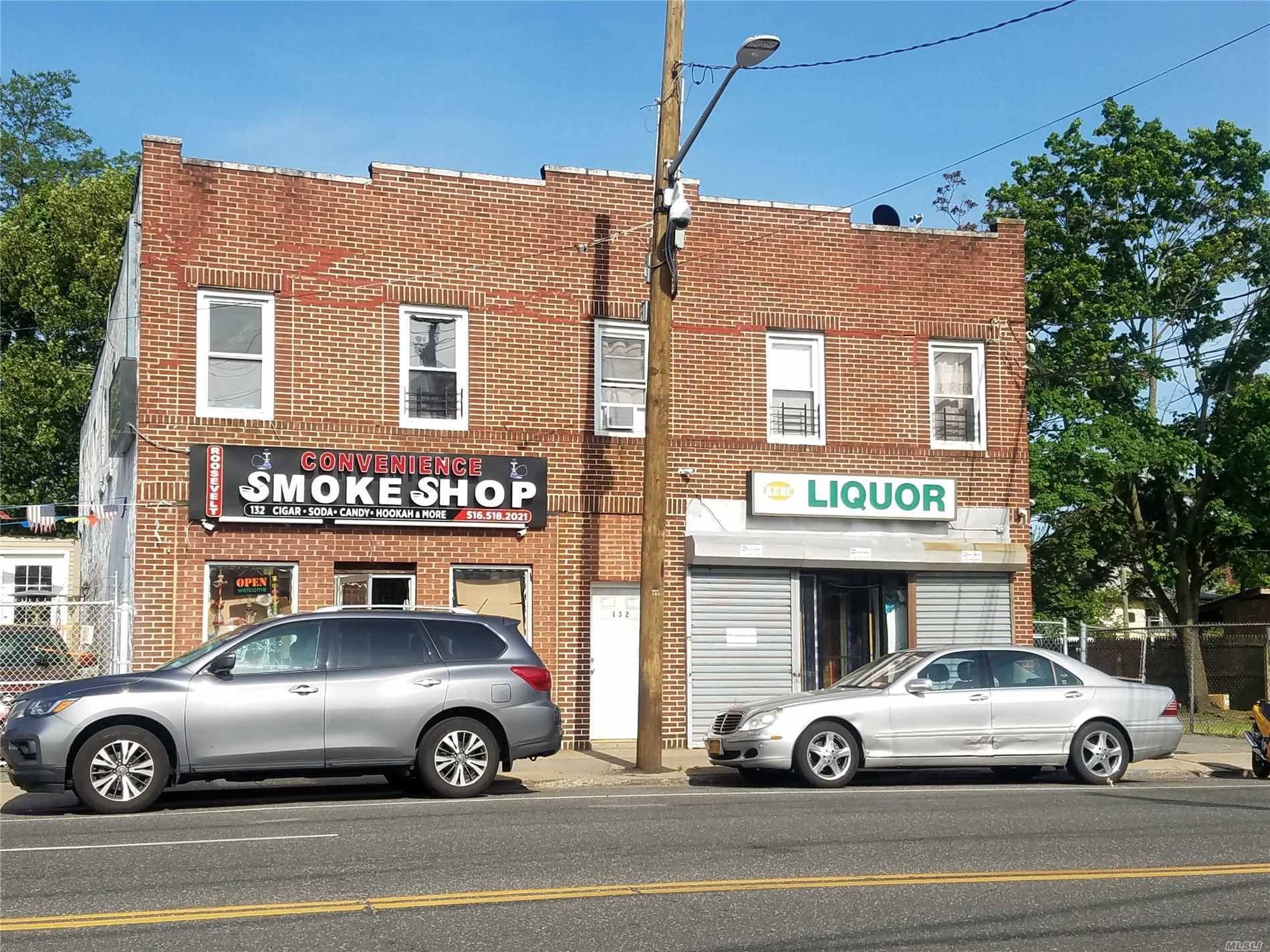 Excellent mix use building with 4 second floor apartments and two 1100 SqFt storefronts below.