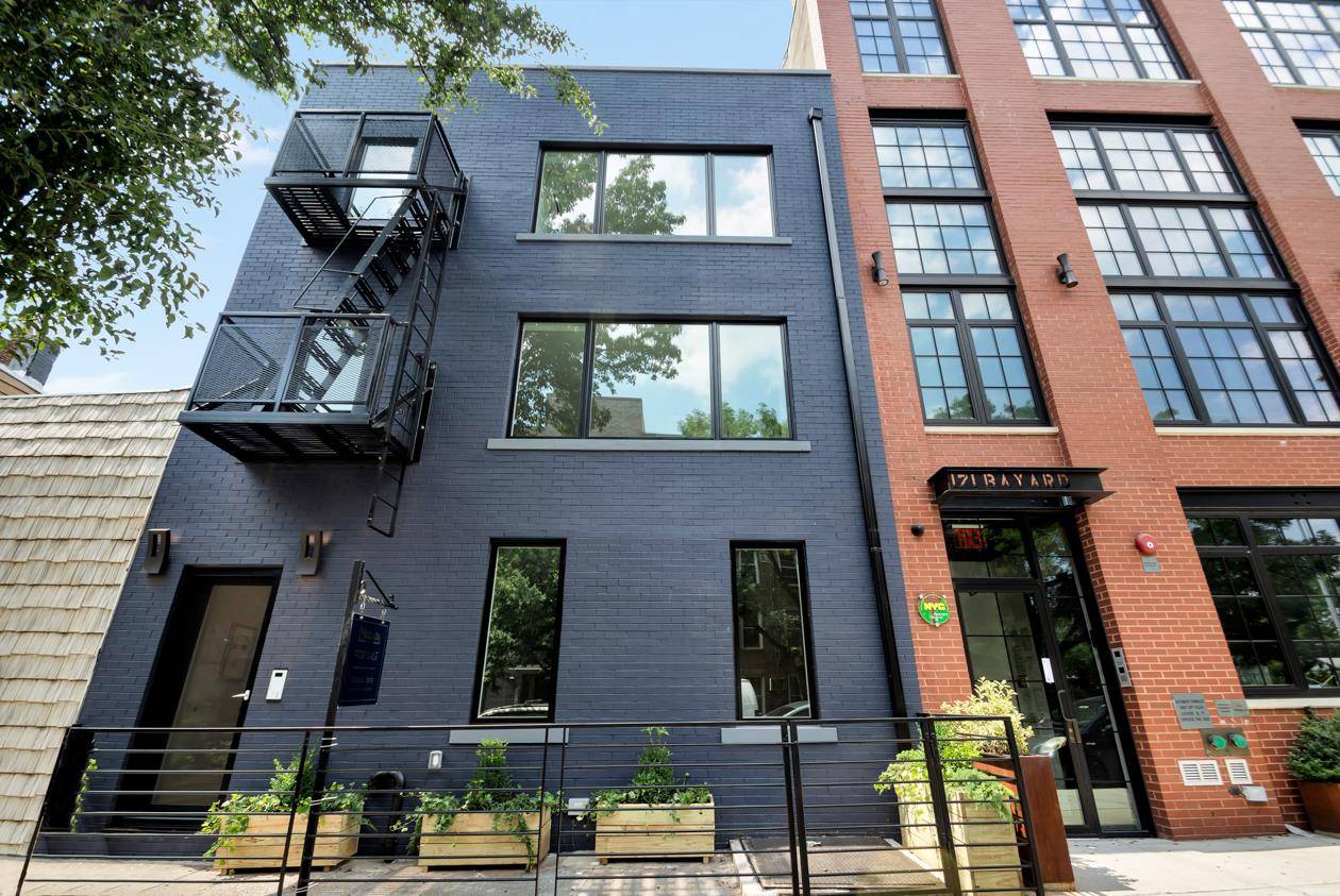 This Greenpoint legal three family property has been redesigned to consist of an owners duplex with a stunning backyard and artist studio space and two rental units with basement.