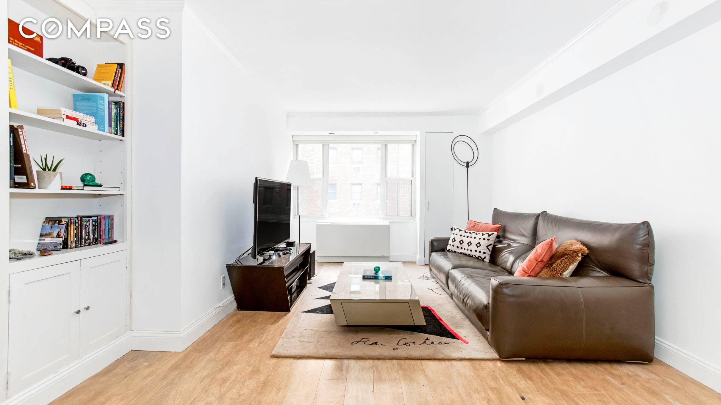 Embrace effortless living and iconic Chrysler Building views in this truly stunning updated corner unit double exposure one bedroom, one bathroom home in a full service Murray Hill co op.