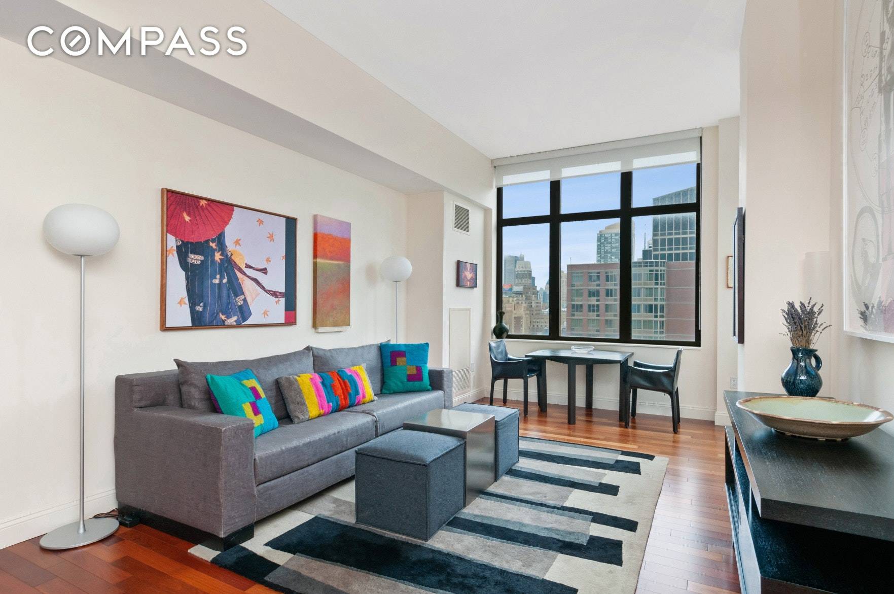 Welcome to this stunning triple mint 1 bedroom condominium at the Chelsea Stratus, a quintessential Manhattan home with sky high views in a sought after full service building in Chelsea.