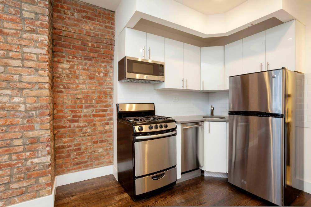 Inside, this apartment features a rare balance of pre war detail like exposed brick with the highest level of renovation GE range, refrigerator, dishwasher, and built in microwave.
