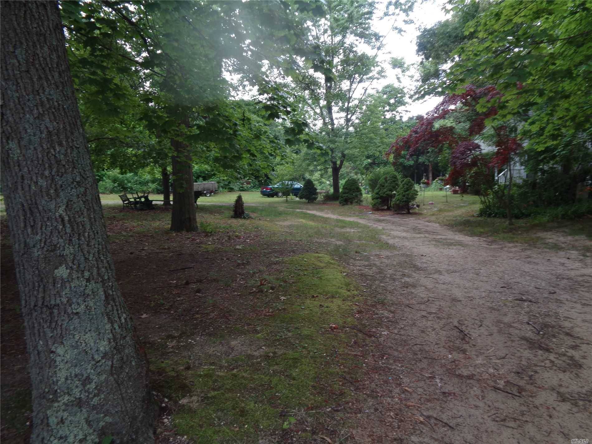beautiful 7 acres of land in the Nesconset, also includes and existing 3 bedrooms cape and lake,