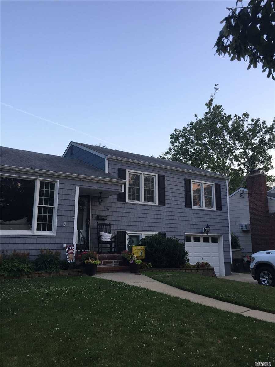 Beautifully updated split level home in Wantagh Woods on an oversized large property 65x125, Wantagh School District.