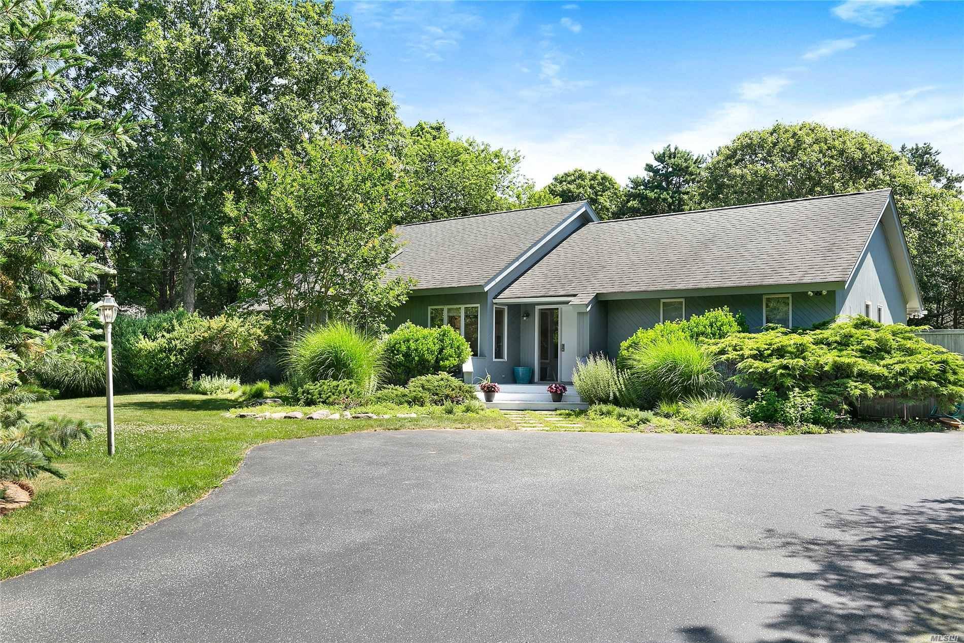 Quiet serene south of the highway contemporary with three bedrooms, two baths, heated pool and tranquil setting.