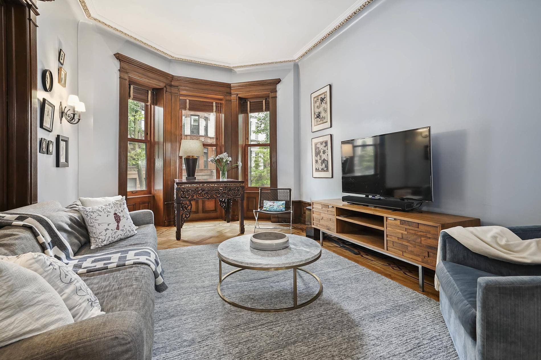 Found among a row of limestone townhouses designed with full height curved bays, opulent L shaped stoops and Neo Italian Renaissance style on one of the prettiest Park Slope streets ...