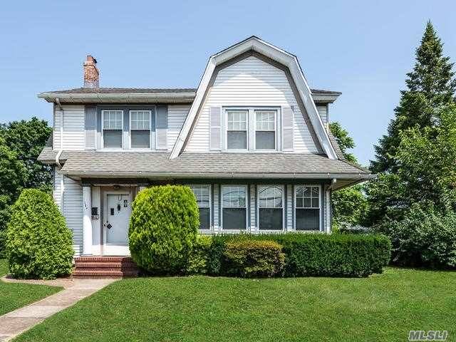 Welcome to this stately Dutch Colonial set on a rare 100x140 lot in the desired 'Boulevard Section' of Mineola !