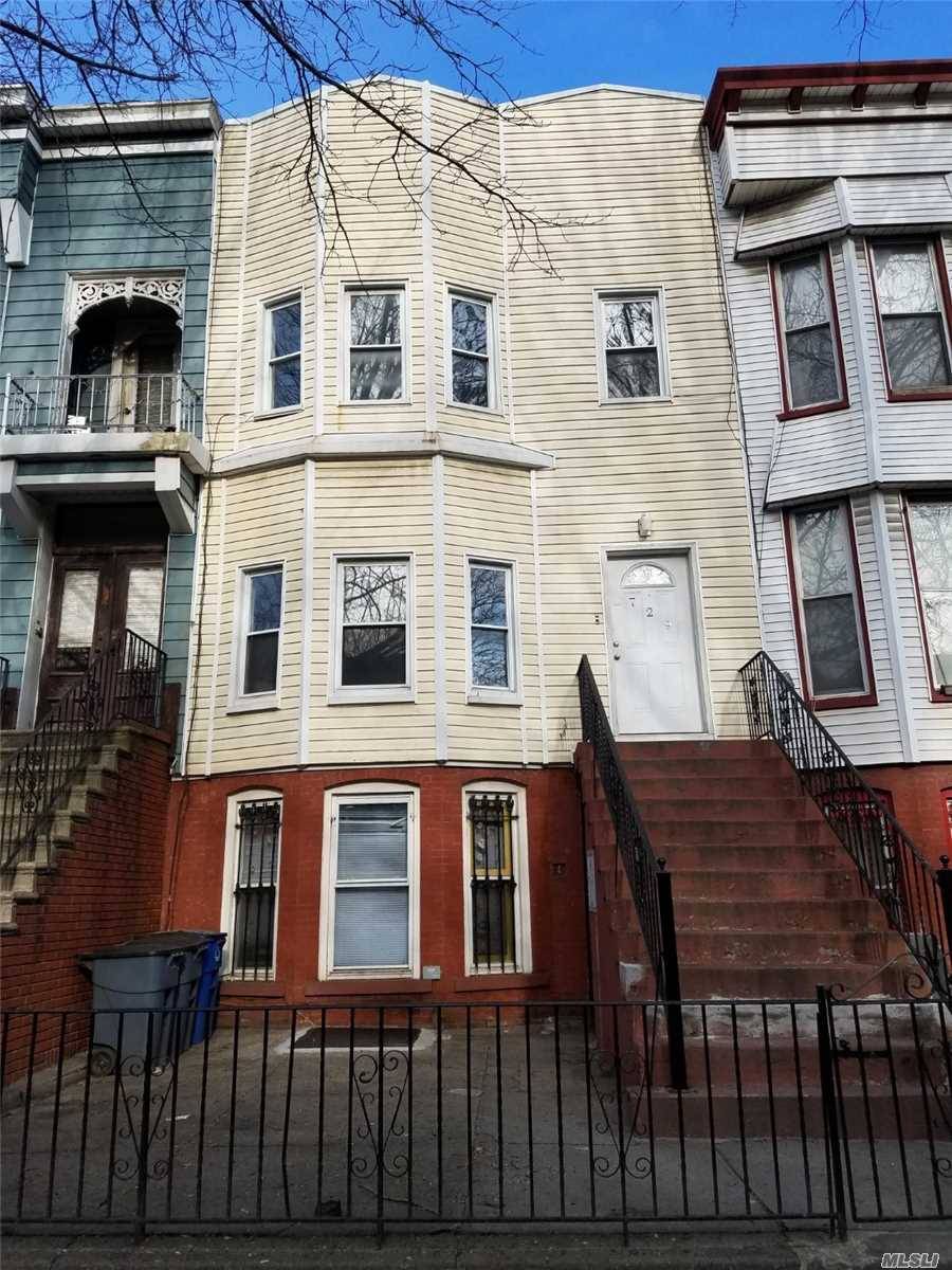 This beautiful 2 family row house is for sale on a quiet tree lined block of Bushwick.