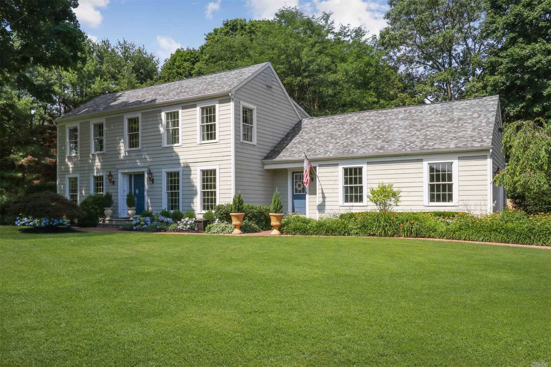 Beautifully updated Center Hall Colonial on Flat Acre.