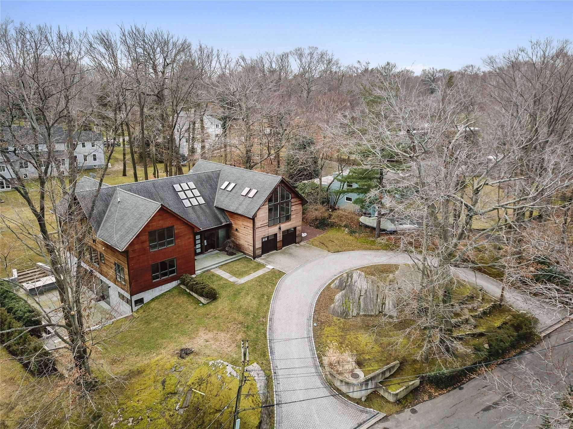 Rare Bank Owned Pelham Manor Contemporary With Large Light Filled Rooms Throughout.