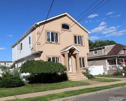 Spacious 2350 Sq Ft Colonial Situated Mid Block In South Merrick.