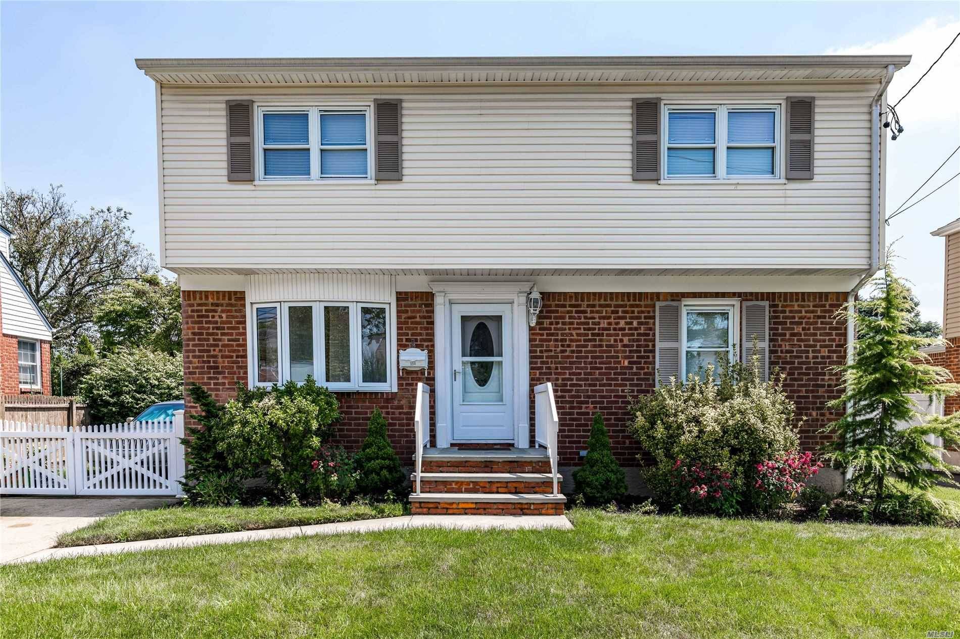 WELCOME TO THIS FIVE BEDROOM TWO BATH COLONIAL LOCATED IN THE HEART OF MINEOLA.
