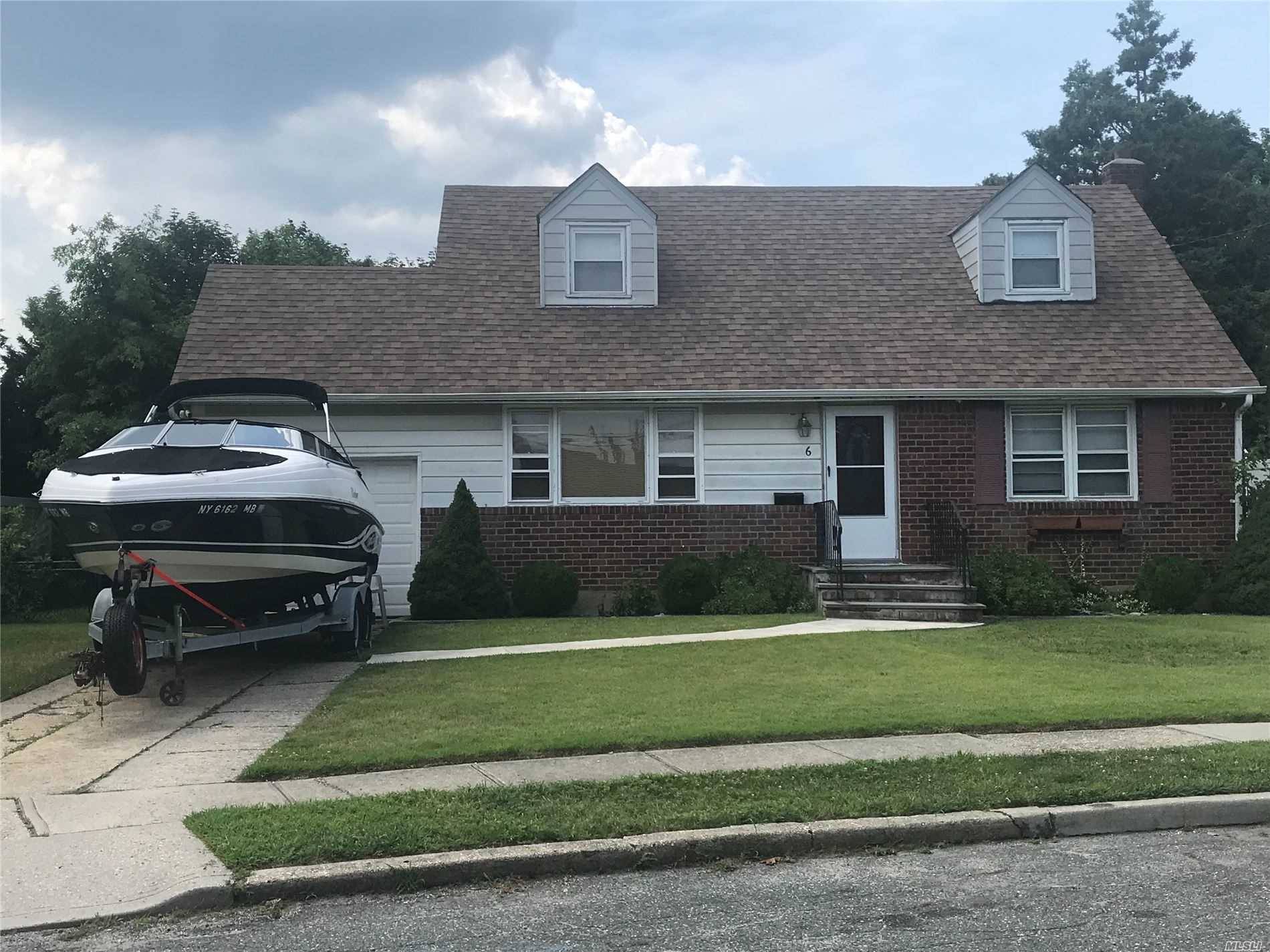 7 rooms 4 bedrooms 2 baths and upstairs bath dormer all hardwoods new roof gas heating huge lot 70x137 bethpage school district 21 garage and driveway mint !