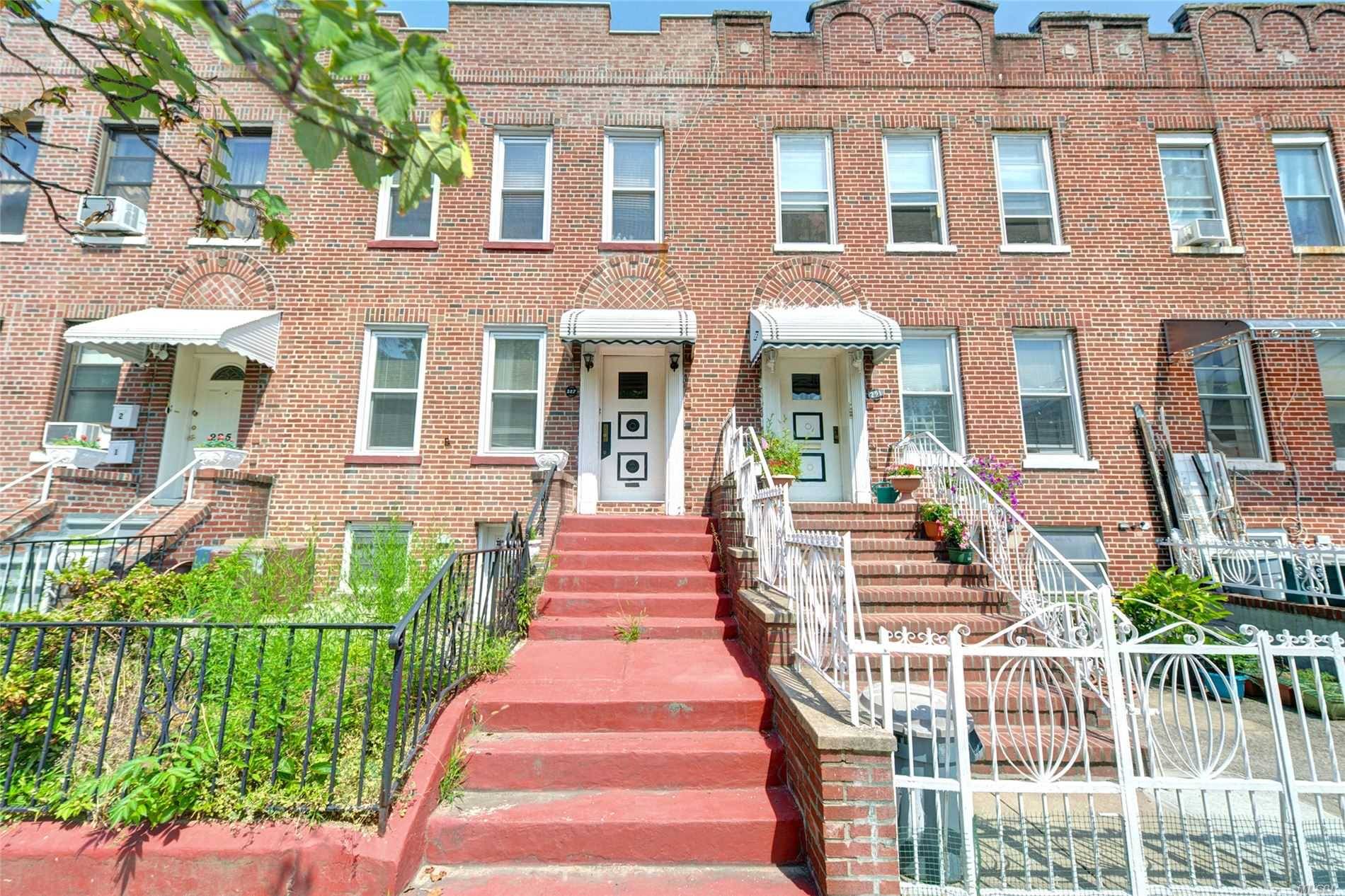 All Brick Attached 2 Family For Sale Featuring Spacious 2BR Apartments On Each Floor Plus Full Finished Basement And 2 Car Attached Garage !