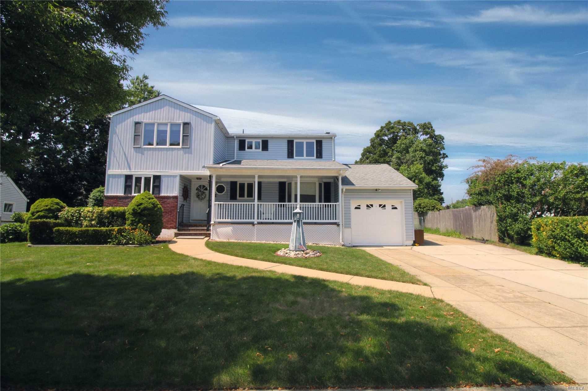 In the heart of Massapequa, nestled in a cozy neighborhood, this potential Mother Daughter sits on a large piece of property w expansive backyard.
