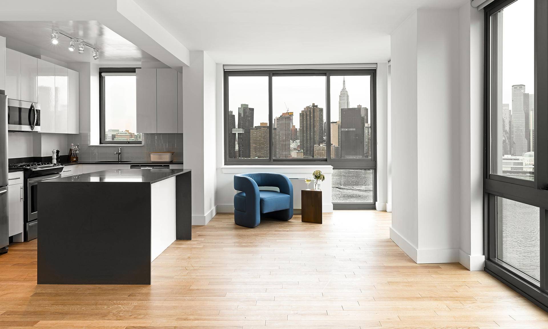 LIC Spacious, Fully Renovated 1 Bed with a Magnificent Open Kitchen, a Large Corner Living/Dining Area, a Corner Bedroom and a Private Balcony with Views of Lower Manhattan and the Freedom Tower.