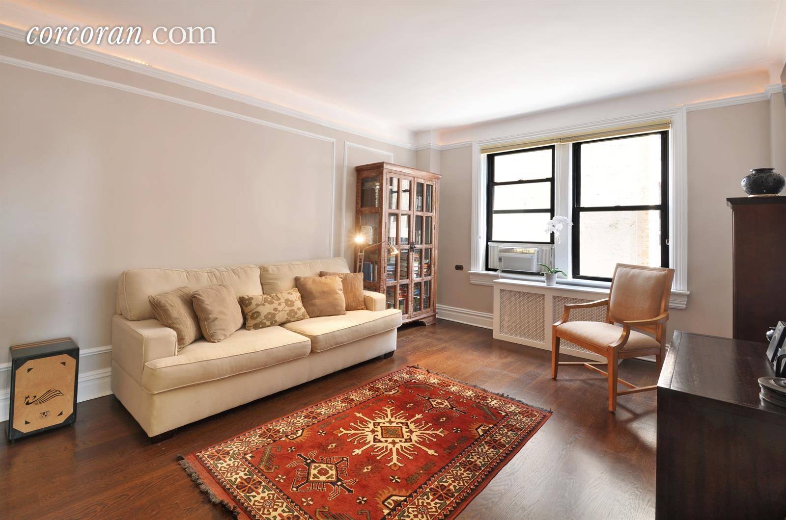 This generously sized, corner one bedroom apartment in a classic prewar Rosario Candela Upper West Side building draws you in with its original detailing, thoughtful layout, and lots of windows.