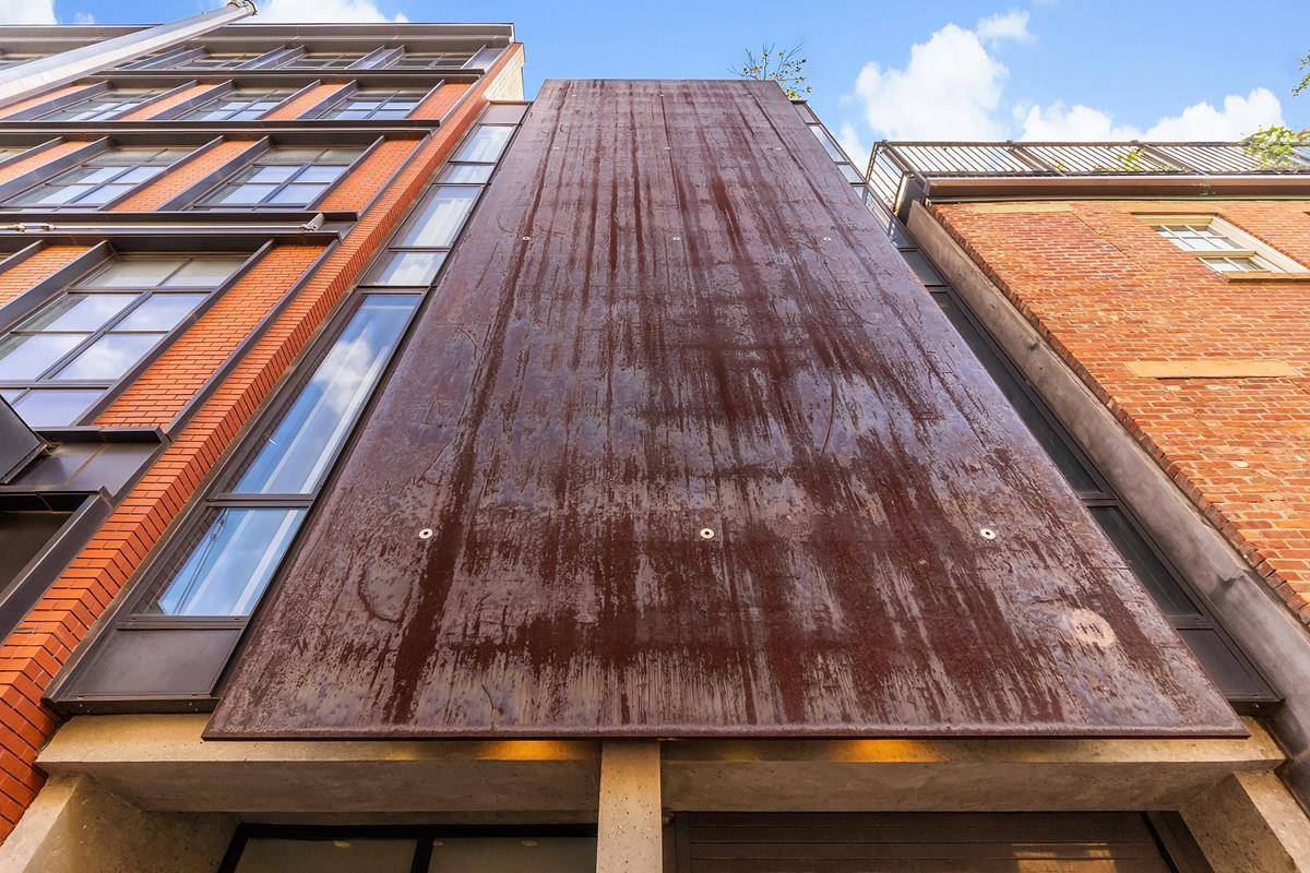 829 Greenwich Street a stunning contemporary single family townhouse with a much sought after private parking garage sits on the dividing line between the West Village and Meatpacking Districts.