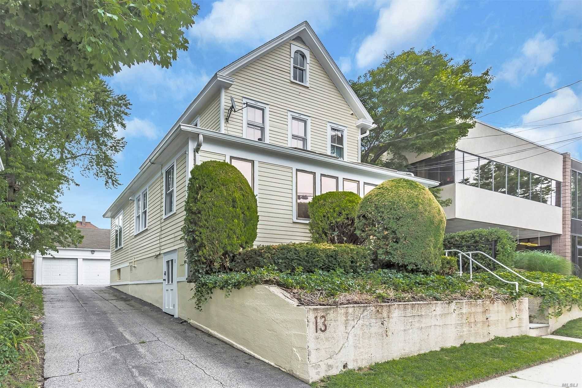 Directly across from LIRR, incredible visibility locations, mixed use building, alarm, newly painted iside out, fire retardant, 2 garages, plus 4 5 parking spots for extra income.