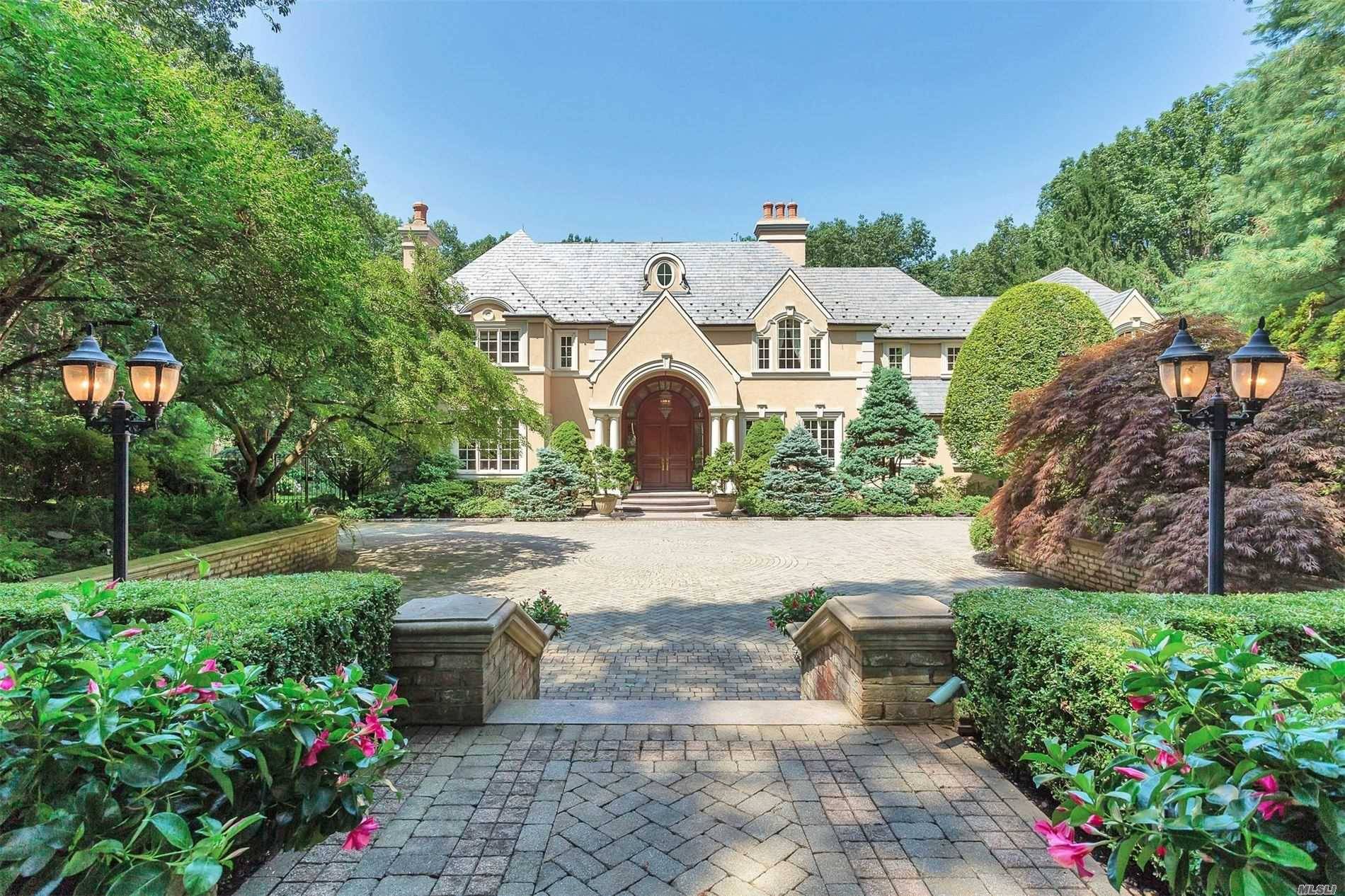 Journeys End is an Architecturally Rich Mansion, Privately Gated in 3 Lush view enriched Acres, 180ft of Prime Cold Spring Harbor Water Front Beach with a Guest Beach House and ...
