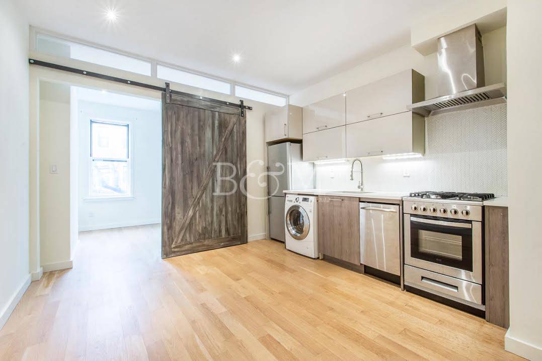 Our Thoughts This renovated two bedroom apartment features condo like finishes.