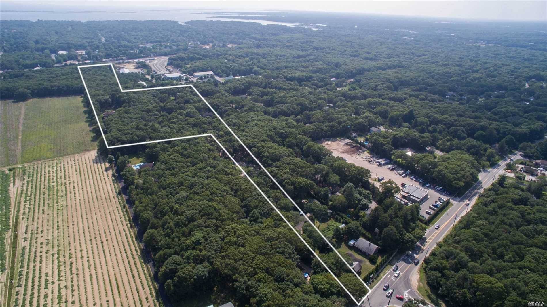 Nearly 20 acres of land with two rental properties on site.