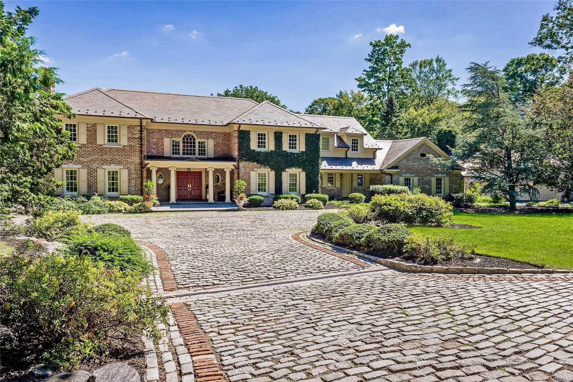 Gorgeous Manor home set on 5 lush acres in ultra private location near private clubs schools.