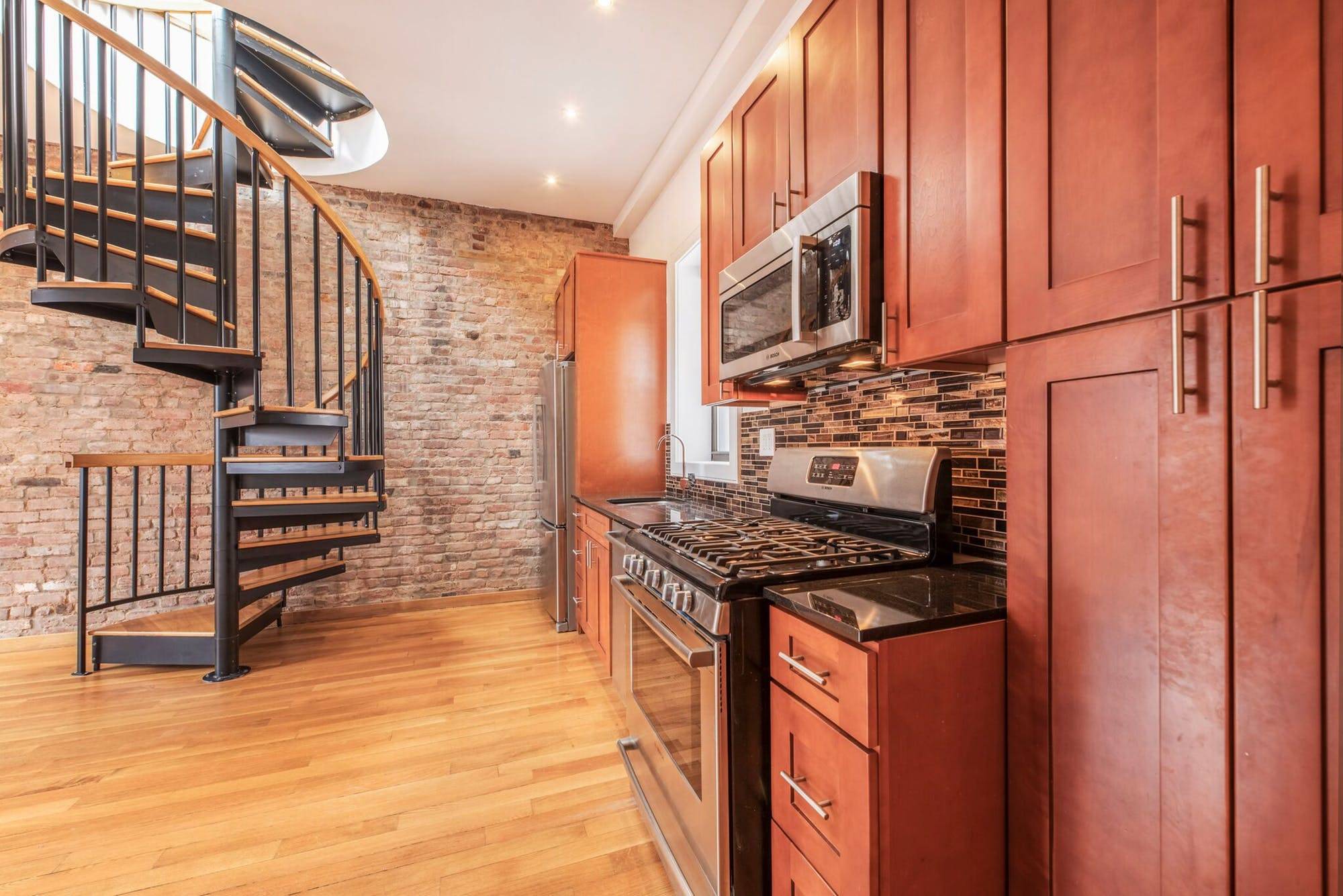 Located on a quiet tree lined street in the heart of Soho, this 6 story stunner offers the perks of new construction without losing any of its pre war charm.