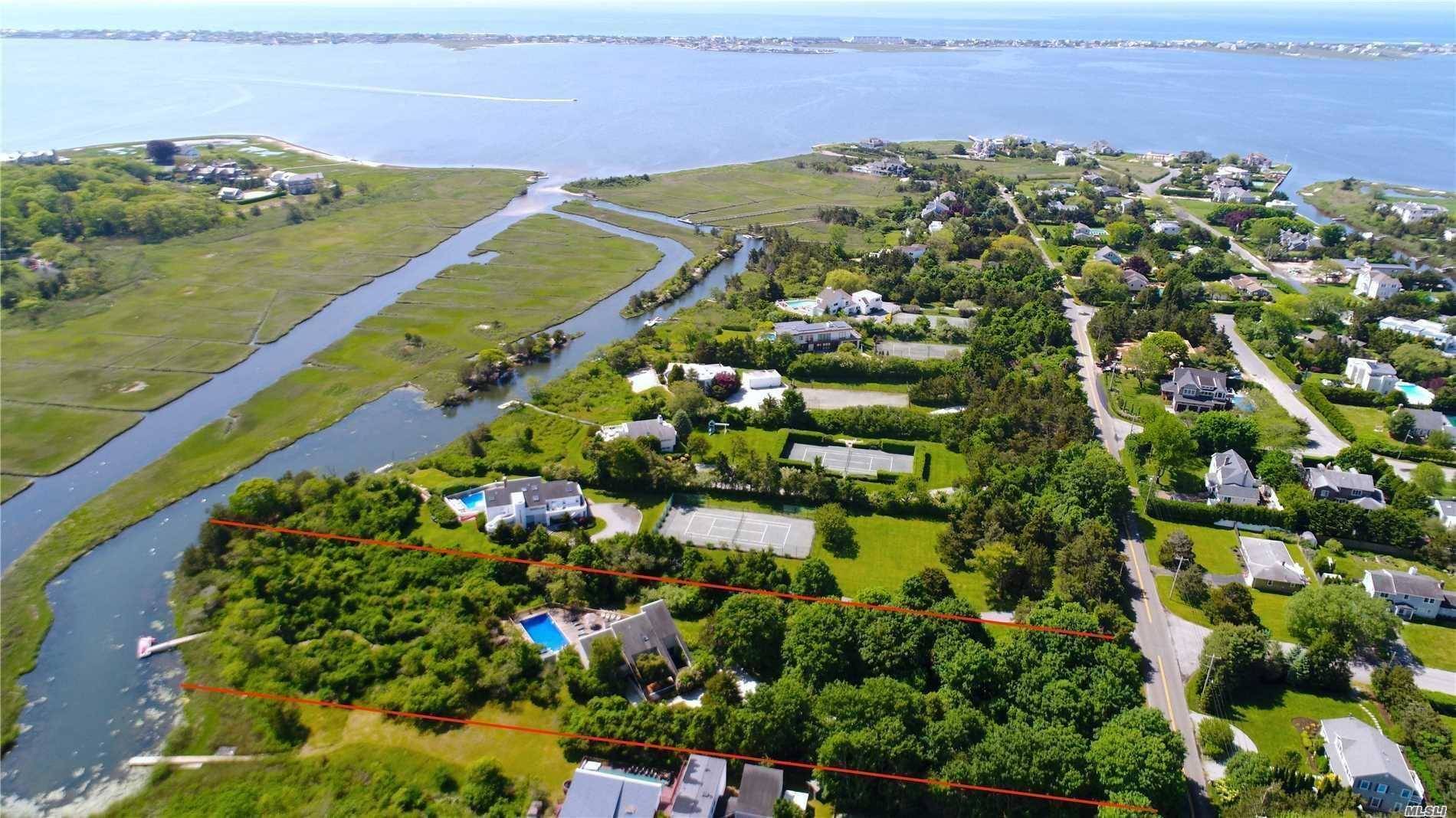 2. 3 acres of prime waterfront property on the canal with 169' of water frontage and existing private dock.